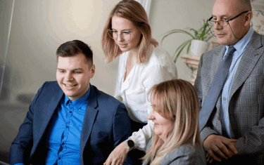 Image of employees in an office gathering