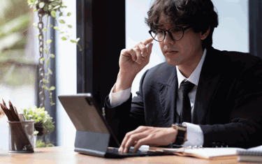 Image of employee having a digital meeting in the office