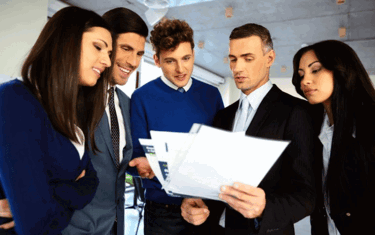 Image of Manager showing team printed report 